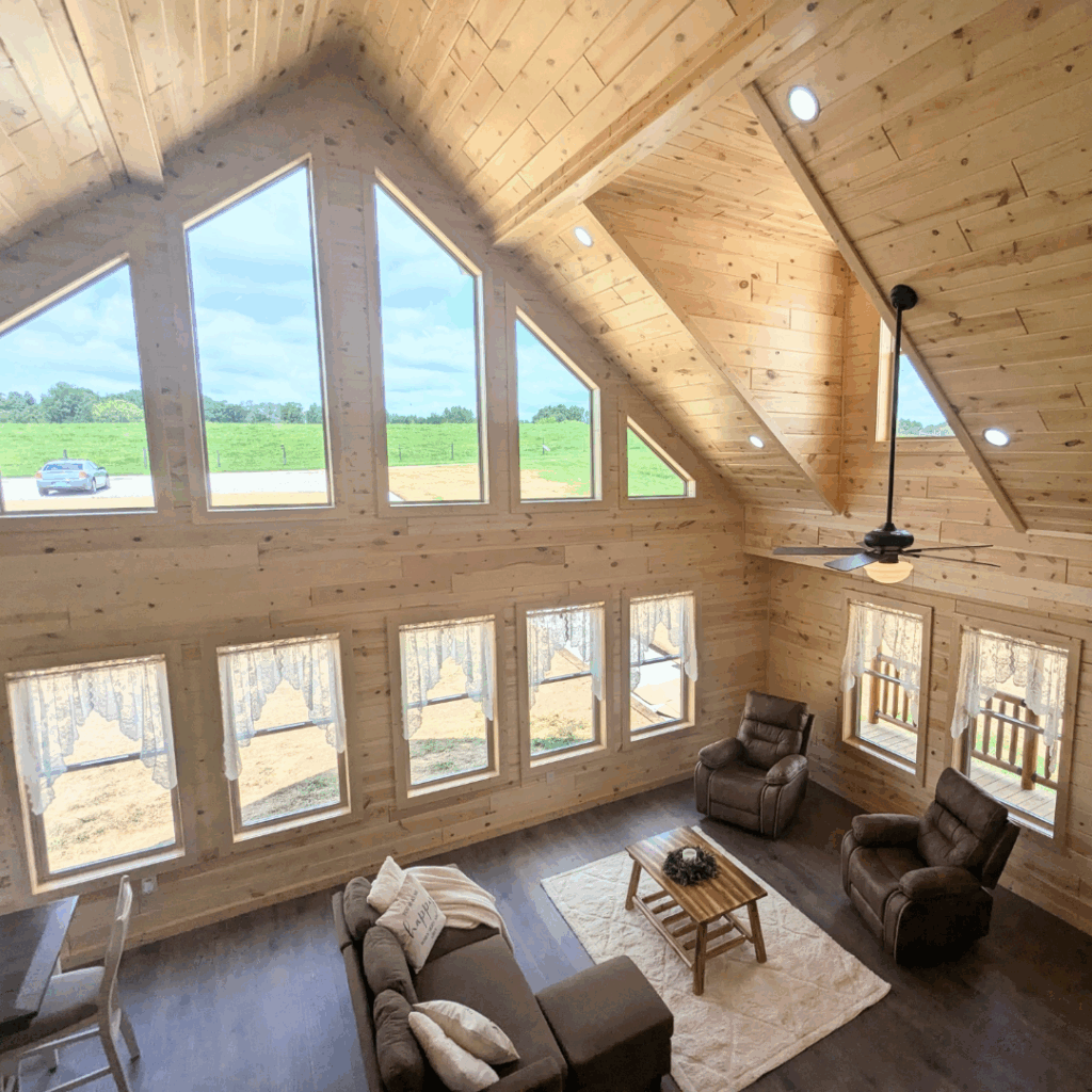 Trophy Peak model front and side wall interior with windows and living room furniture.